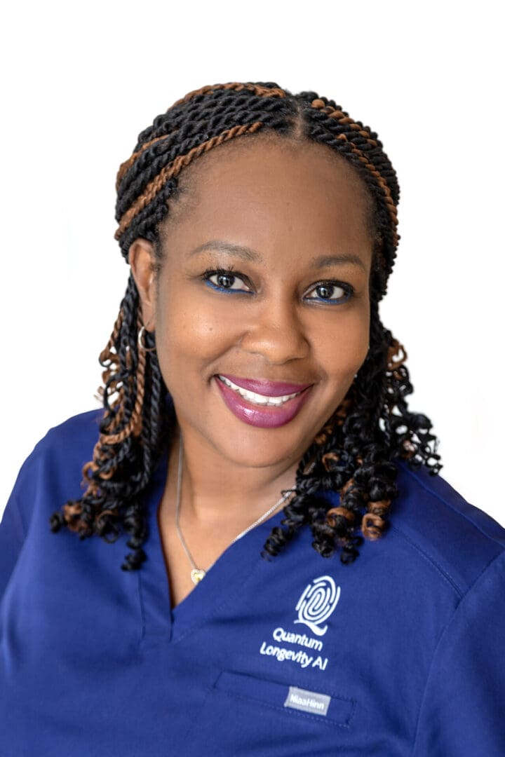 Smiling woman in blue medical uniform.
